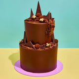 2 Tier Ultimate Chocolate Cake with rich chocolate ganache, handmade truffles, shards, and edible gold leaf decoration.